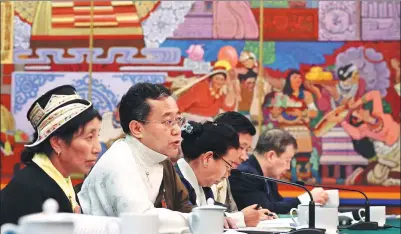  ?? WANG ZHUANGFEI / CHINA DAILY ?? Phurbu Dondrub, a deputy to the 13th National People’s Congress, speaks at a plenary meeting of the Tibet autonomous region’s delegation to the top legislatur­e’s annual session in Beijing on Thursday.