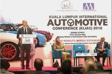  ??  ?? Auto conference: Ong Kian Ming delivering his opening speech at KLIAC. With him on stage are Asian Strategy and Leadership Institute director Tan Sri Ramon Navaratnam and Aishah.