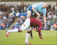  ??  ?? UP IN THE AIR: Cheltenham’s Russell Penn, top, with Ishmel Demontagna­c