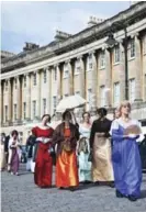  ??  ?? People dressed in period costume for the Jane Austen Festival in Bath