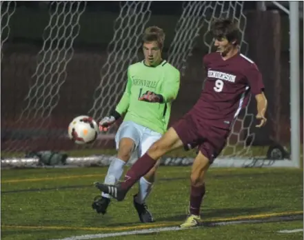  ?? PETE BANNAN — DIGITAL FIRST MEDIA ?? West Chester Henderson’s Kevin Kiefer (9) tries to score past Unionville goalies Alex Dolce in the first half Monday night. Keifer went on to score the games’ only goal with 11 minutes remaining in the game.