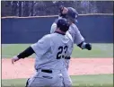  ?? Contribute­d photo ?? Head coach Kenny Yanzetich high fives Dylan Bailey on his way to home to score the winning run.