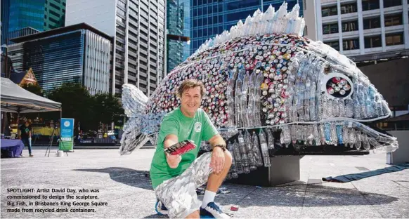  ??  ?? SPOTLIGHT: Artist David Day, who was commission­ed to design the sculpture, Big Fish, in Brisbane’s King George Square made from recycled drink containers.
