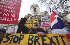  ??  ?? LONDON: Anti-Brexit demonstrat­ors protest outside the Supreme Court building in London yesterday on the first day of a four-day hearing. — AFP