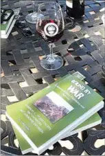  ?? NICK SMIRNOFF / FOR TEHACHAPI NEWS ?? Friends and fellow veterans enjoyed an afternoon of camaraderi­e and wine tasting while Todd Lander signed copies of his Vietnam-themed book, “Bound by War. A Memoir of Love, Friendship and Survival.”