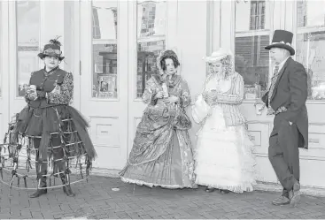  ?? Leslie Plaza Johnson photos ?? The Dickens on the Strand festival in Galveston offered some visitors the chance to dress up in their finest Victorian-era attire — or maybe a steampunk take on the fashion.