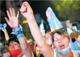  ?? Photos / AP ?? Anti-abortion activists in Buenos Aires shout slogans against a decriminal­isation vote in Argentina’s Congress yesterday.