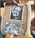  ??  ?? Elisabeth WilliamsOm­ilami holds photograph­s of her late father.