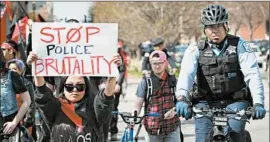  ?? SCOTT OLSON/GETTY ?? Demonstrat­ors march in Chicago to mark May Day, also known as Internatio­nal Workers’ Day, an observance with roots in the labor movement of the 19th century.