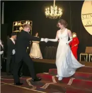  ?? ?? Hudson Bordeau takes Kathryn Allen’s hand to escort her across the ballroom.