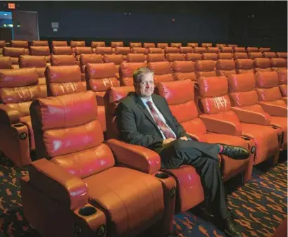  ?? JERRY JACKSON/BALTIMORE SUN PHOTOS ?? Andrew Seyler, manager of Sun & Surf Cinema, sits in one of the theaters at the 50-year-old Ocean City establishm­ent. Earlier this year, owner Fox Theatres sold the eight-screen cinema for redevelopm­ent, garnering more than $7 million.