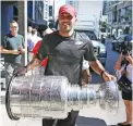  ?? STEVE RUSSELL/TORONTO STAR FILE PHOTO ?? Ray Emery, who won a championsh­ip with Chicago, brings the Stanley Cup to Toronto in 2013.