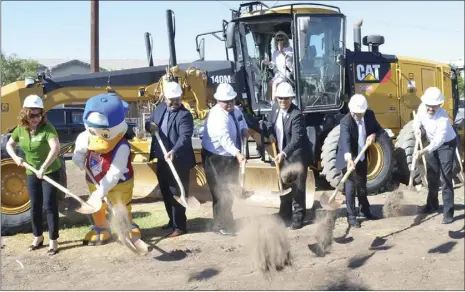  ??  ?? The Imperial Irrigation District’s Dippy Duck joins El Centro city officials on Wednesday for the groundbrea­king ceremony for the city’s $15.7 million aquatic center at Adams Park. JULIO MORALES