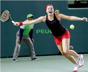  ?? AP ?? Jelena Ostapenko of Latvia hits a return to Petra Kvitova of the Czech Republic during their match in the Miami Open on Monday in Key Biscayne. Ostapenko won 7-6 (7-4), 6-3. —