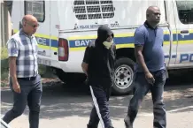  ?? ZANELE ZULU African News Agency (ANA) ?? THE suspect taken in for questionin­g following the death of Chatsworth grandmothe­r Jennifer Pillay, right, is, left, in between Detective Sergeant Shadrack Govender and Constable Luthando Movovo. |