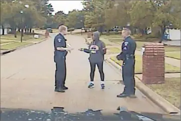  ?? Corinth Police Department ?? A POLICE CAMERA records officers as they talk with African American journalism dean Dorothy Bland, who later complained that she was racially profiled when they stopped her while walking in her neighborho­od.