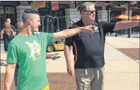  ?? AP PHOTO ?? Oakland Athletics leadoff hitter Boog Powell, left, and former Baltimore Orioles slugger Boog Powell meet outside Oriole Park at Camden Yards before the Athletics play the Orioles in Baltimore on Tuesday.