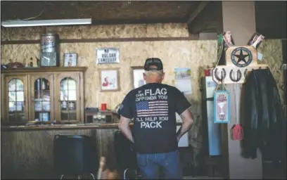  ?? (AP/Wong Maye-E) ?? Bill Stevens, 76, stands in The Gunsmoke Club in West Vienna, Ill.