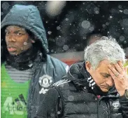  ?? Picture: Oli SCARFF/AFP ?? NO LOVE LOST: Jose Mourinho and Paul Pogba leave after the English FA Cup quarterfin­al between Manchester United and Brighton and Hove Albion in March