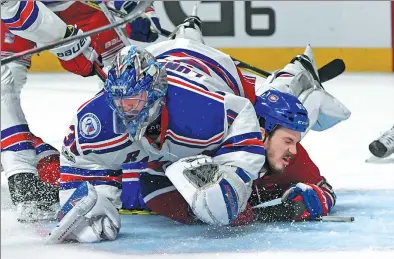  ?? ERIC BOLTE / USA TODAY SPORTS ?? New York Rangers goalie Henrik Lundqvist winds up on top of Montreal Canadiens forward Andrew Shaw following a third-period collision in Wednesday’s opening game of their Stanley Cup quarterfin­al at Bell Centre in Montreal. Lundqvist made 31 saves to...