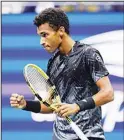  ??  ?? Felix Auger-Aliassime of Canada, reacts to a point during a match against Carlos Alcaraz, of Spain, in the quarterfin­als of the US Open tennis tournament, on Sept 7, in New York. (AP)