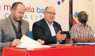  ?? Picture: WERNER HILLS ?? CRACKING DOWN: Mayor Athol Trollip, centre, at a media conference at City Hall, with MMC for budget and treasury councillor Retief Odendaal, left, and acting CFO Jackson Ngcelwane