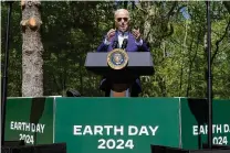  ?? MANUEL BALCE CENETA / ASSOCIATED PRESS ?? President Joe Biden speaks at Prince William Forest Park on Earth Day, Monday, in Triangle, Va. Biden is announcing $7 billion in federal grants to provide residentia­l solar projects serving low- and middleinco­me communitie­s and expanding his American Climate Corps green jobs training program.