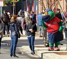  ??  ?? HELLO! Wally the Green Monster entertains the voters.