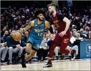  ?? RON SCHWANE — THE ASSOCIATED PRESS ?? Detroit Pistons forward Isaiah Livers (12) drives against Cleveland Cavaliers forward Dean Wade (32) during the game, Wednesday, in Cleveland.