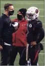  ?? Stephen Brashear / Associated Press ?? Cardinals quarterbac­k Kyler Murray meets with coach Kliff Kingsbury.