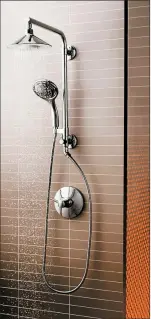  ?? KOHLER ?? Kohler’s Moxie showerhead coordinate­s with its Flipside hand shower and HydroRail shower column.