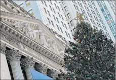  ?? MARY ALTAFFER/AP ?? New York Stock Exchange is festive amid a wary market.