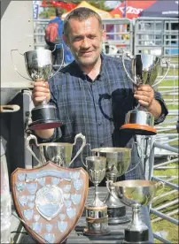  ?? Photograph­s: Iain Ferguson, The Write Image. ?? Clockwise from main above: Welcome sunshine drew a good crowd to Saturday’s Lochaber Agricultur­al Show; Lochaber Show president Malcolm Cameron; Joker the Ferret; John Nudds with his clutch of trophies; There was some fierce competitio­n in the...