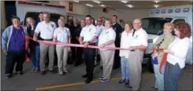  ?? LISA MITCHELL - DIGITAL FIRST MEDIA ?? Northeaste­rn Berks EMS in Kutztown hosted a ribbon cutting with the Northeast Berks Chamber of Commerce during their Open House on May 6. Cutting the ribbon is Doug Demchyk, president and Chief of Operations of Northeaste­rn Berks EMS.