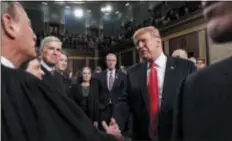  ?? ASSOCIATED PRESS ?? President Donald Trump talks to Supreme Court Chief Justice John Roberts while leaving the House chamber after giving his State of the Union address to a joint session of Congress on Feb. 5 at the Capitol in Washington.