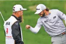  ?? AP PHOTO/NICK WASS ?? Max Homa celebrates with his caddie Sunday after winning the Wells Fargo Championsh­ip.