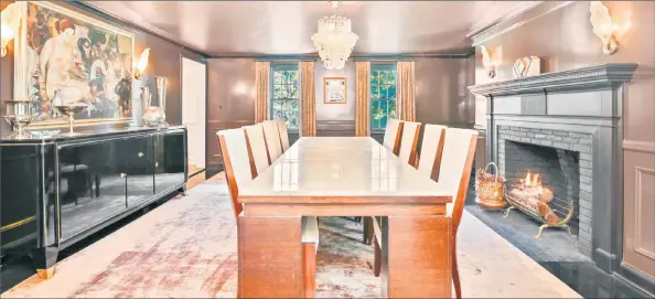  ?? Contribute­d Photo ?? The design of the formal dining room at 928 Lake Avenue in backcountr­y called for a subtle use of statement color, with a rich shade of chocolate on the venetian plaster walls and gold leaf detailing on the ceiling.