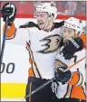  ?? THE CANADIAN PRESS/LARRY MACDOUGAL ?? Anaheim Ducks forward Logan Shaw of Glace Bay, left, celebrates his goal with Andrew Cogliano against the Calgary Flames during third-period NHL action in Calgary, Alta., on Sunday.