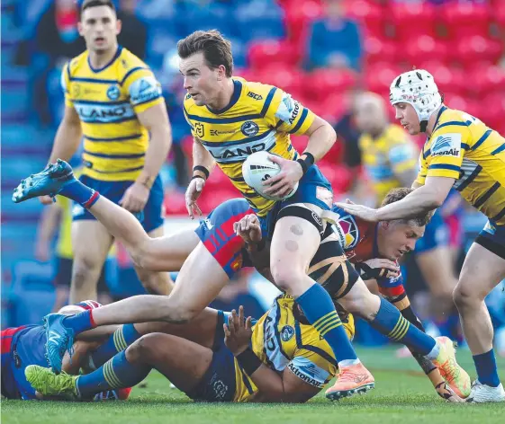  ?? Picture: CAMERON SPENCER/GETTY IMAGES ?? Parramatta’s Clint Gutherson breaks through the Newcastle defence at McDonald Jones Stadium.