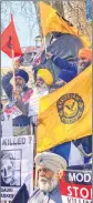  ??  ?? A group of Sikh community people protest against PM’s visit.