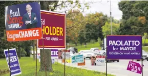  ?? MIKE HENSEN / POSTMEDIA NEWS ?? Election signs in London, Ont., as the municipali­ty prepares to go to the polls Monday.