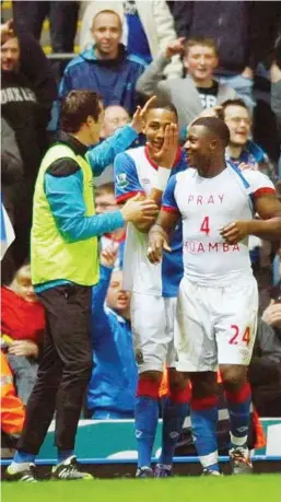  ??  ?? Strong message: Ayegbeni Yakubu (right), wearing a T-shirt in support of Bolton’s Fabrice Muamba, celebrates his goal against Sunderland on Tuesday.