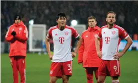  ?? Defeat. Photograph: S Mellar/FC Bayern/Getty Images ?? Kim Min-Jae (left) and Harry Kane (right) look to the stands after Bayern Munich’s latest