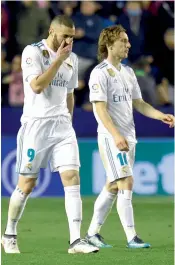  ?? AFP ?? Real Madrid forward Karim Benzema gestures in their La Liga match against Levante at the Ciutat de Valencia Stadium on Saturday. The match ended 2- 2. —