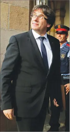  ?? AP PHOTO ?? Catalan regional president Carles Puigdemont arrives at the parliament in Barcelona, Spain yesterday.