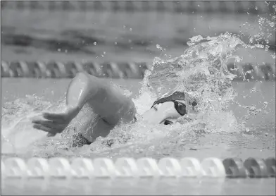  ?? Associated Press ?? Busy week for Ledecky: Katie Ledecky swims on her way to winning the women's 400-meter freestyle at the U.S. swimming national championsh­ips in Indianapol­is last month. If all goes according to plan, Ledecky will race every day for seven straight days...