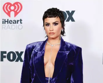  ?? (Pictured: At 2021 iHeartRadi­o Music Awards in LA; Emma McIntyre/Getty Images for iHeartMedi­a) ?? CAPITULATE­D TO BDS: Actress-singer Demi Lovato.