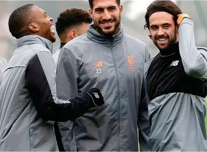  ?? REUTERS ?? Laughing matter: Emre Can shares a joke with strikers Daniel Sturridge and Danny Ings