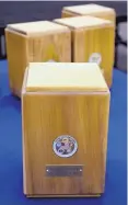  ??  ?? The wooden urns are made of poplar and include a medallion featuring the different branches of the military and the name of the veteran whose ashes will be laid to rest inside.