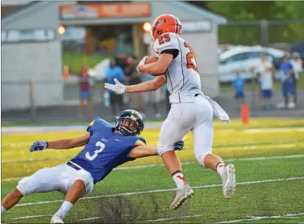  ?? SAM STEWART - DIGITAL FIRST MEDIA ?? Perkiomen Valley’s Justin Jaworski jukes Downingtow­n West’s Cole Zapf on a 53-yard reception Saturday.